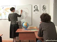 Sexy teacher is spreading her legs on her desk and getting fucked instead of doing her job