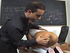 Pigtailed girl is in a doggy style position on her teacher's desk and waiting to get fucked