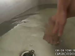 Kinky Japanese teen is playing dirty in front of the camera, while having a shower